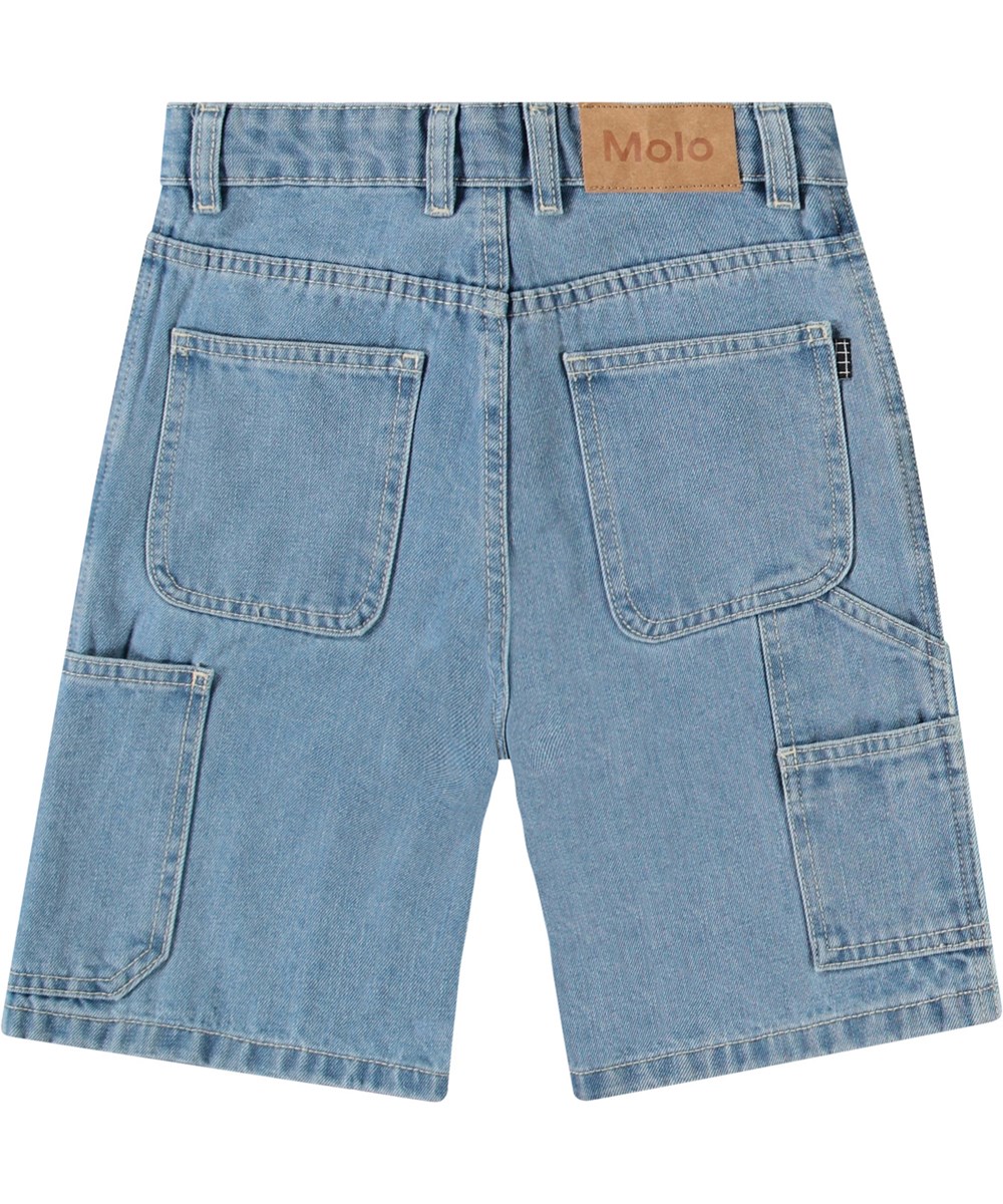 Archie - Indigo Light - Jeansshorts för barn i bomull med arbetsklädseldetaljer.