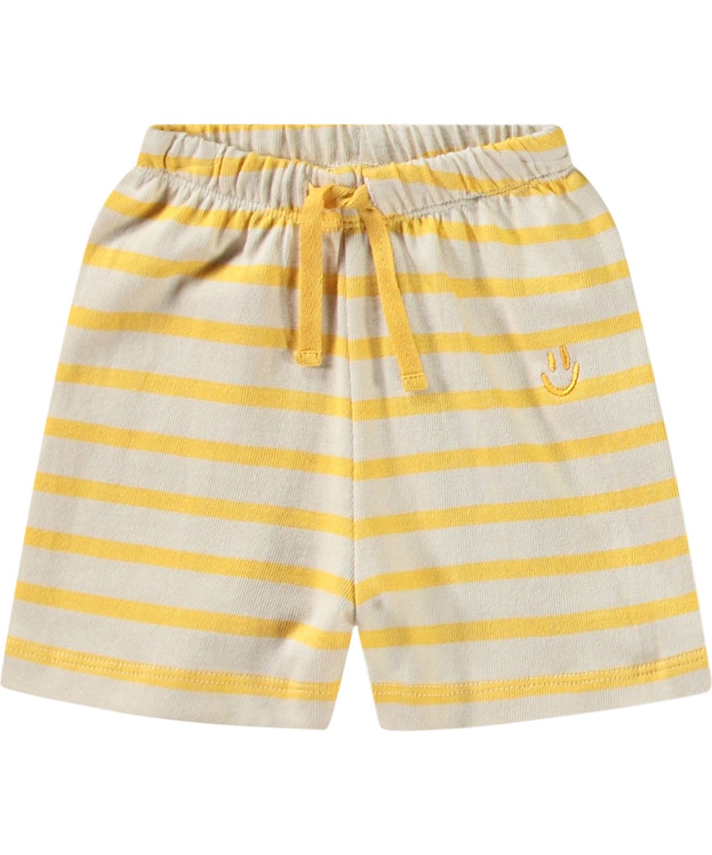 Skie - Mimosa Stripe - Mjuka ekologiska bomullsshorts för spädbarn med gula och beige ränder.