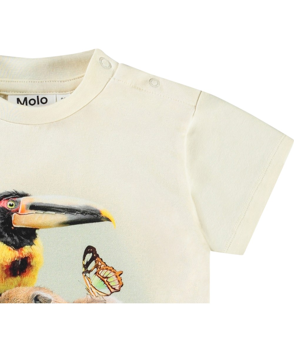 Enzo - Jungle Friends - Klassisk ekologisk bomullst-shirt för baby. T-shirten är krämfärgad med en främre tryck av djungeldjur.