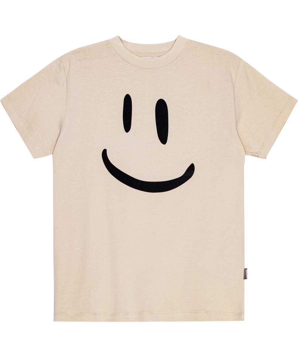 Roxo - White Noise - Molo x Plan International beige T-shirt i ekologisk bomull med en stor smiley tryckt på framsidan.