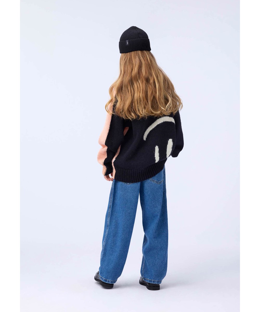 Bello - Double Smile - Rosa och svart stickad tröja för barn gjord av en alpackaullsblandning med leende ansikten.