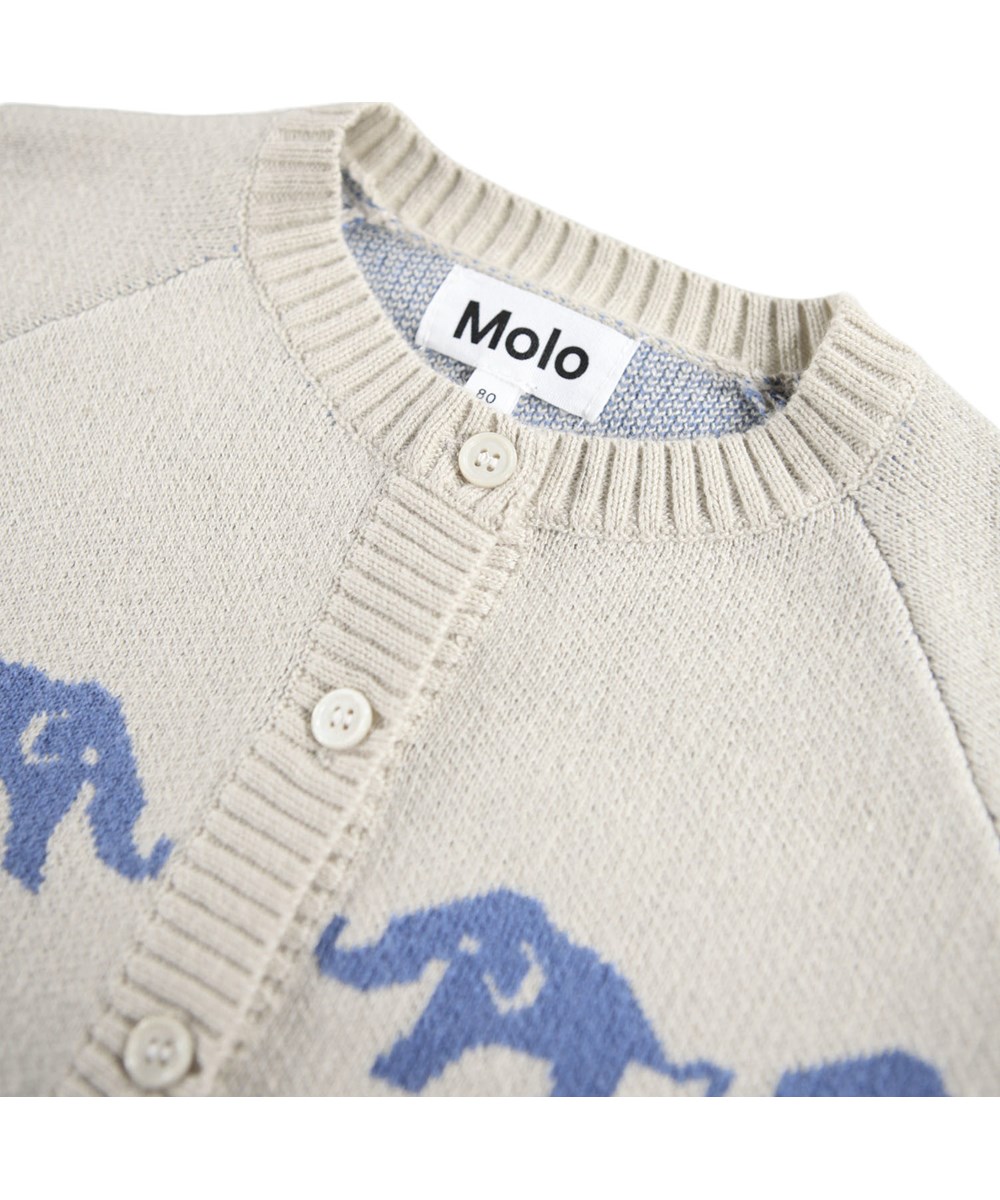 Bobi - Blue Elephants - Råvit stickad kofta för de minsta i en mjuk bomulls- och ullblandning med en kant av blå elefanter.