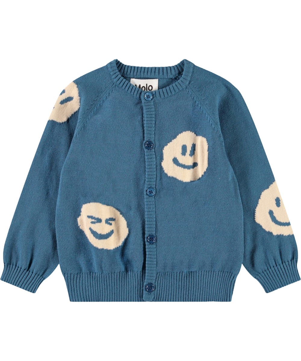 Brody - Lagoa - Stickad kofta för baby i mjuk ekologisk bomull. Koftan är blå med smileys.
