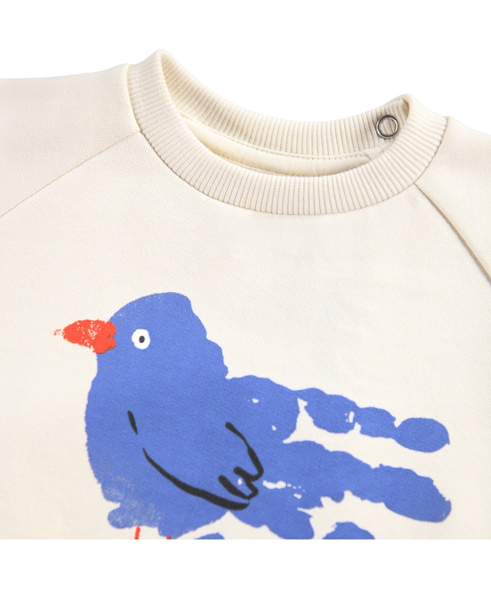Disc - Blue Bird - En vit sweatshirt för de minsta i mjuk ekologisk bomull med en blå fågel framtill.