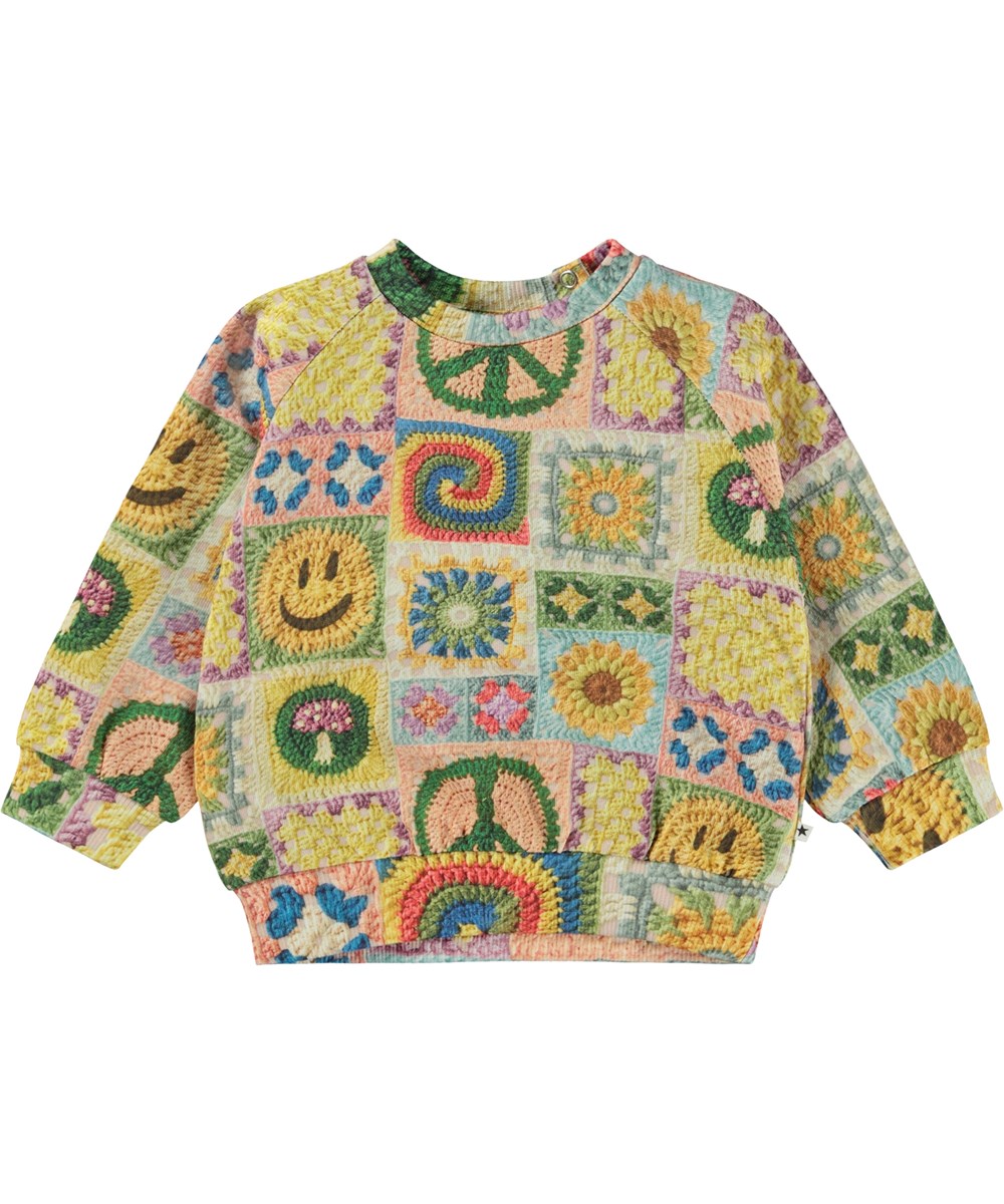 Disc - Crochet Vibe Baby - Multifärgad ekologisk babytröja med virket mönster.