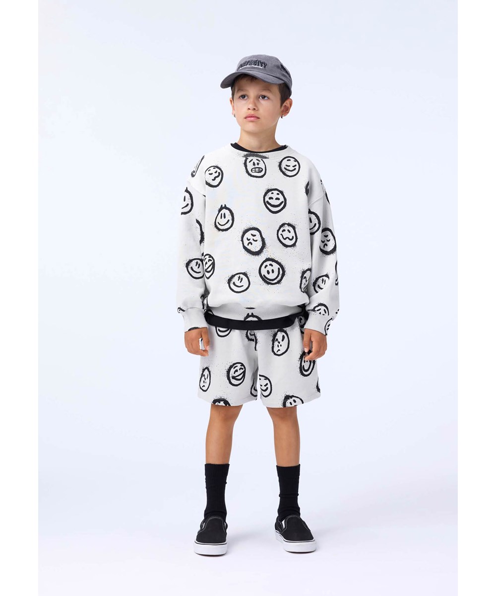 Monti - Different Moods - Off-white sweatshirt för barn i mjuk ekologisk bomull med smileys i olika stämningar.