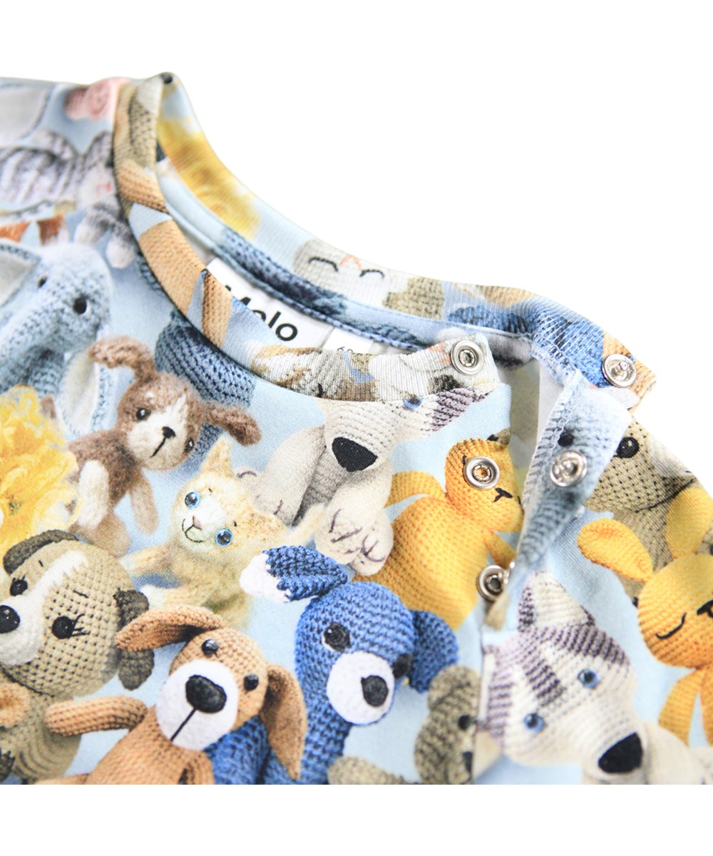 Fairfax - Crochet Cuties - Beige babypakje gemaakt van zacht biologisch katoen met een print van gehaakte dieren.