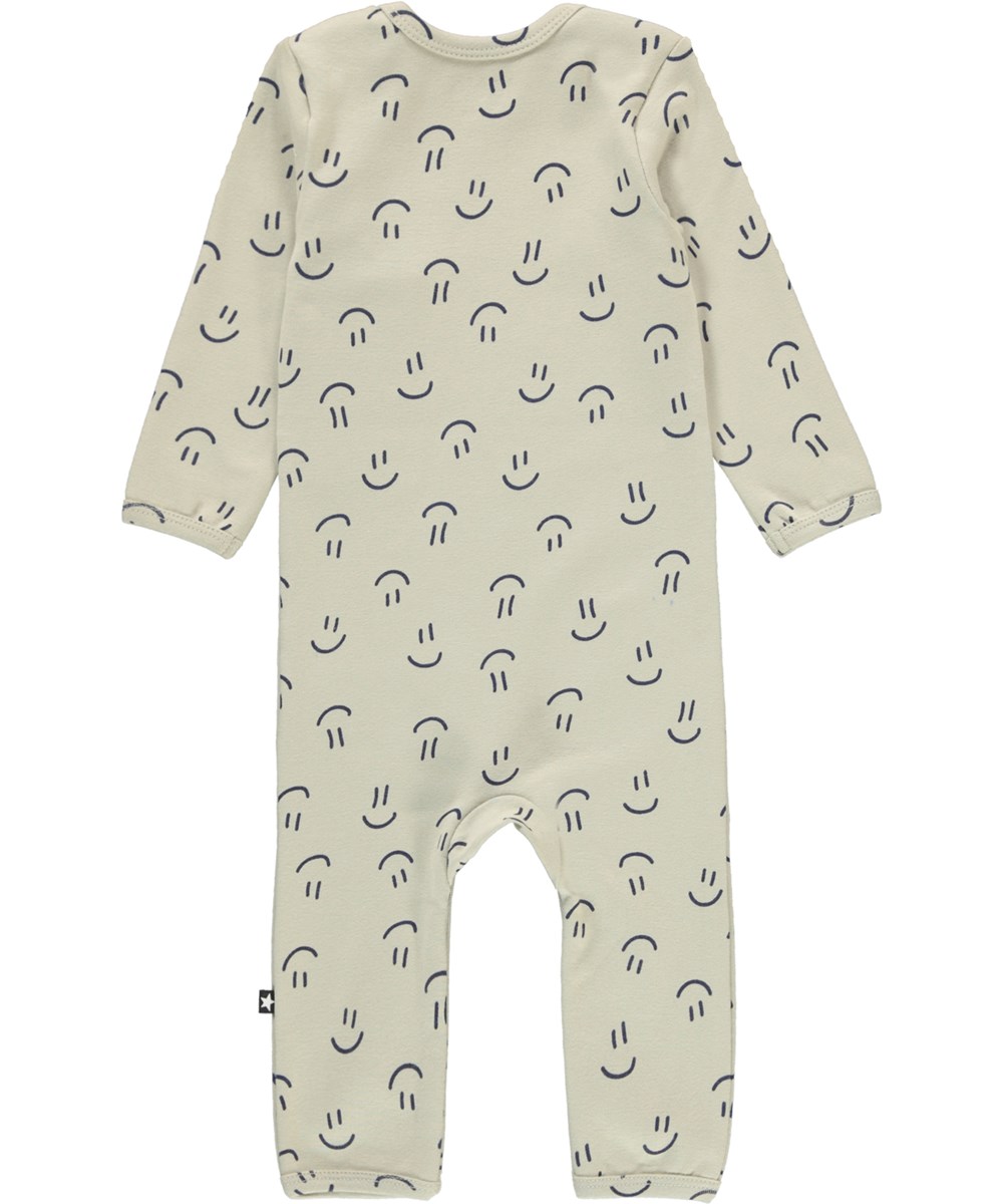 Faso - Happy Graphic - Beige biologische babypakje met een print van smileys