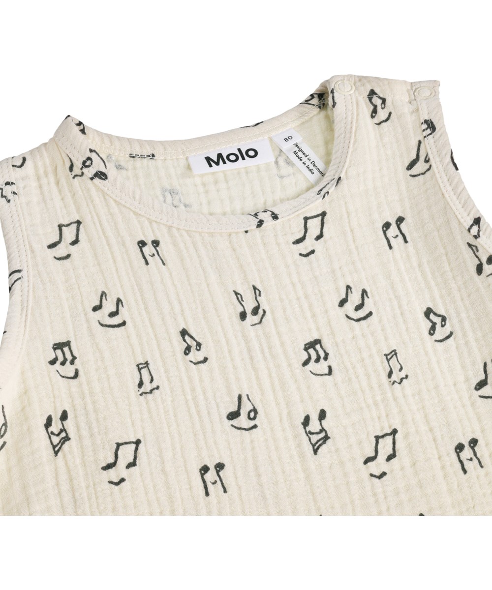 Forever - Happy Notes - Cremefarvet sommerheldragt til baby med musikprint i økologisk bomuld