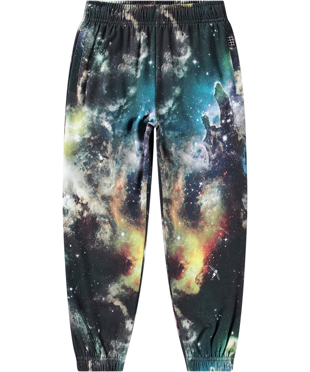 Adan - Out There - Kleurrijke biologisch katoenen joggingbroek met print geïnspireerd op het heelal in een normale pasvorm.