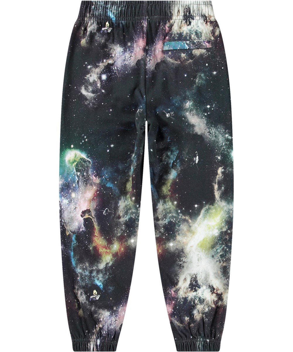 Adan - Out There - Kleurrijke biologisch katoenen joggingbroek met print geïnspireerd op het heelal in een normale pasvorm.