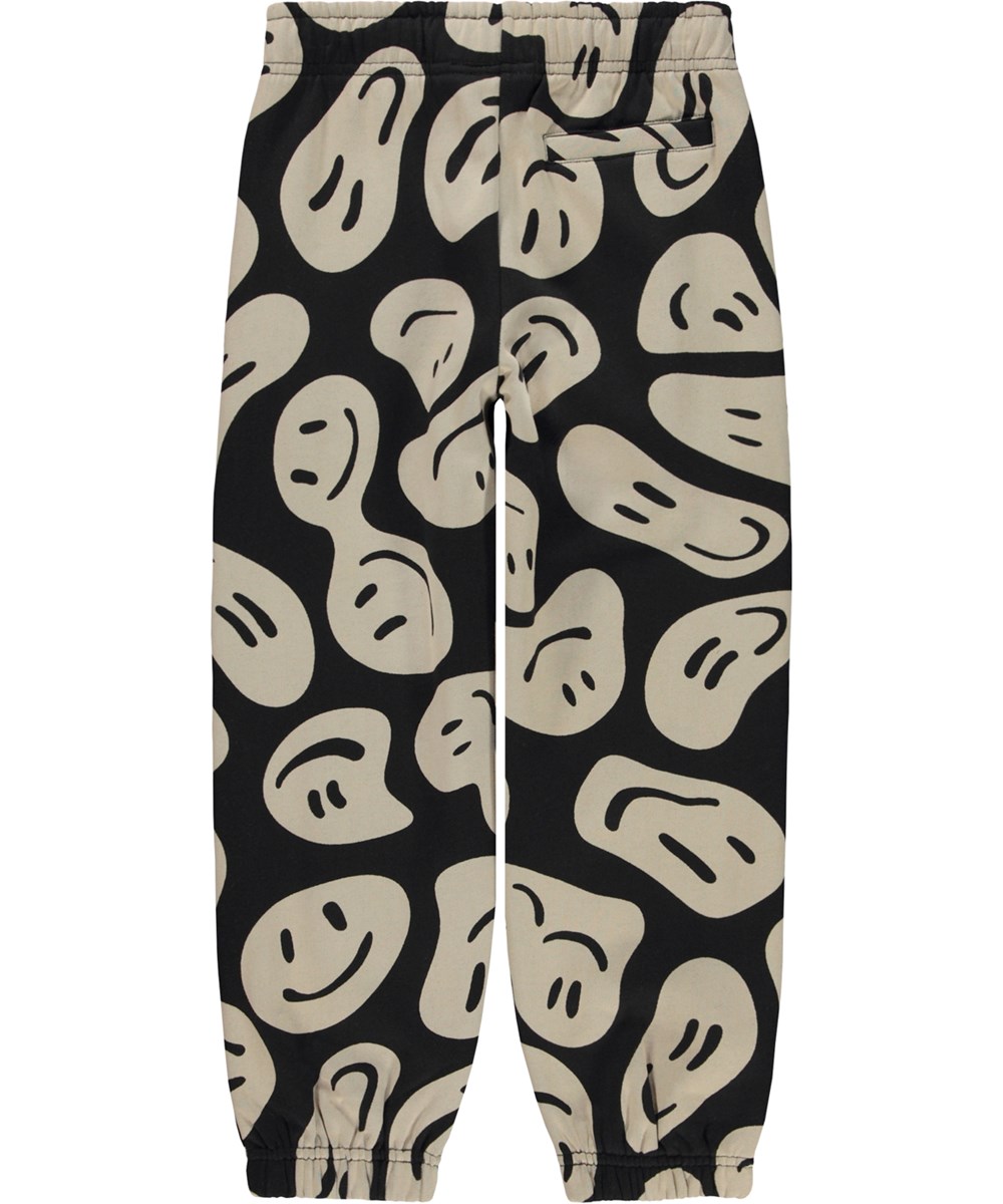 Adan - Smile On Black - Zwarte en beige biologische joggingbroek met een print