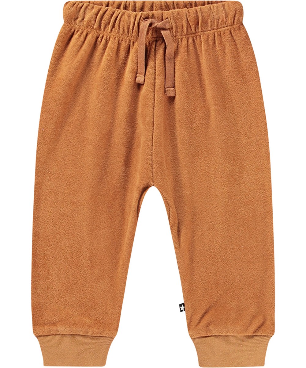 Sigo - Brown Sugar - Oranje biologisch katoenen fluwelen joggingbroek met elastische tailleband en koordje.