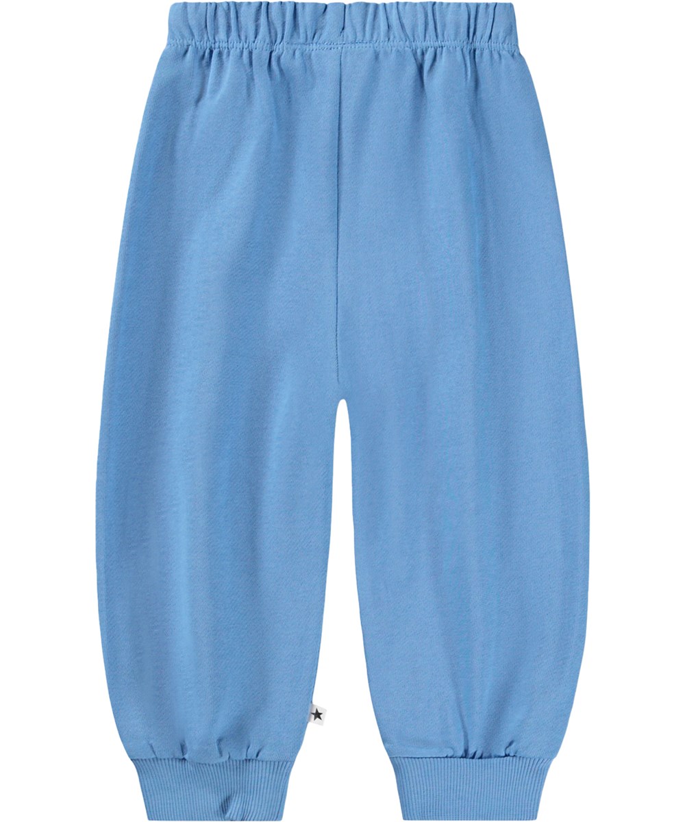 Simeon - Blue Tide - Zachte, blauwe joggingbroek voor de kleintjes gemaakt van biologisch katoen met grappige kniestukken.