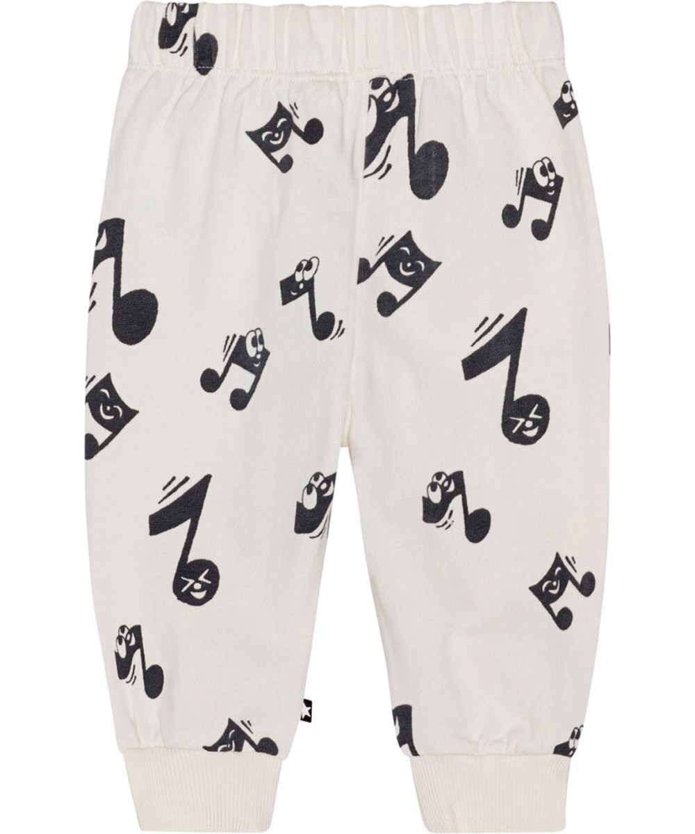 Simeon - Happy Notes - Voor kleine kinderen een gebroken witte joggingbroek van biologisch katoen met een print van lachende muzieknoten