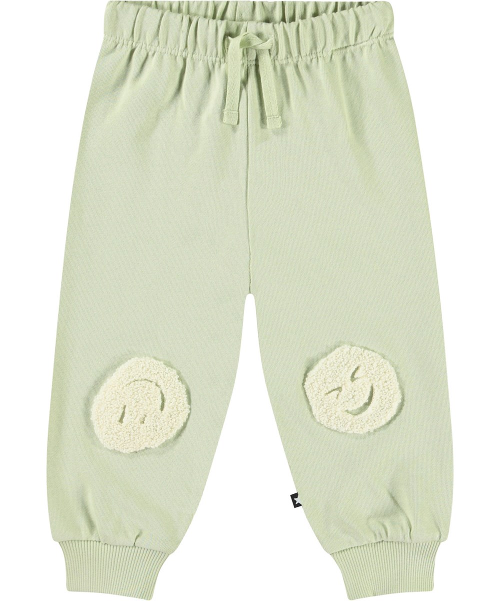 Simeon - Misty Green - Zachte babybroek van biologisch katoen. De broek is lichtgroen met een smileyprint.