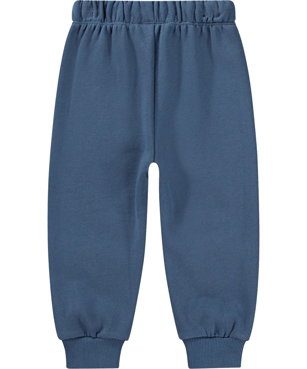 Simeon - Teddy Friend - Blauwe biologische katoenen joggingbroek met gevoerde binnenkant, elastische tailleband, ribboorden en teddybeer patches.