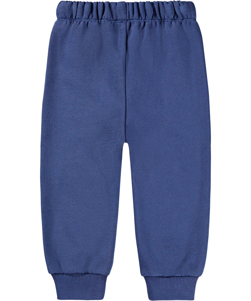 Simeon - Toy Elephant - Zachte broek voor de kleintjes gemaakt van biologisch katoen. De broek is donkerblauw met blauwe olifantjes op de knieën.