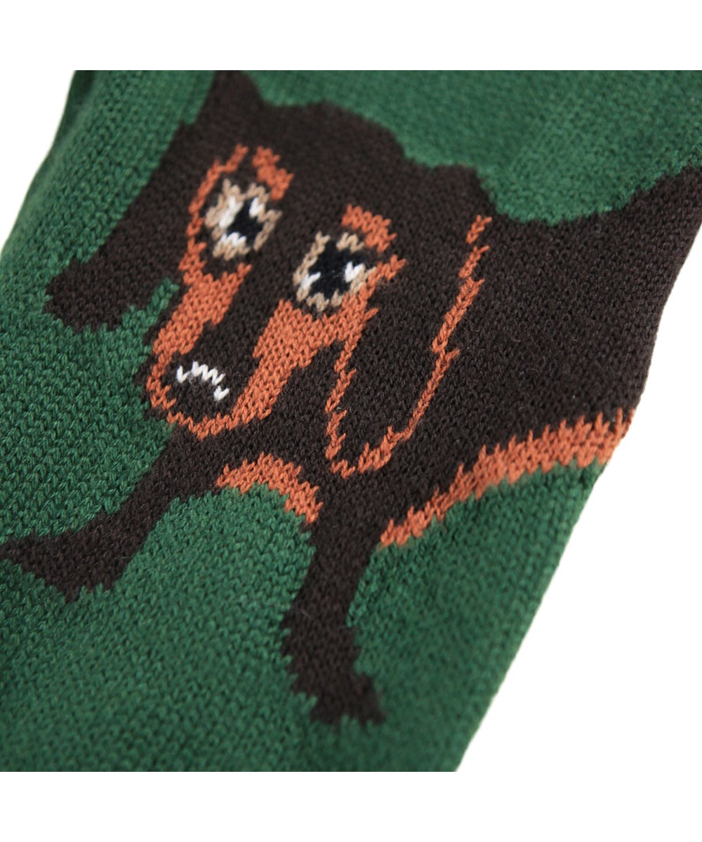 Sol - Dachs Puppy - Donkergroene gebreide broek voor de kleintjes gemaakt van een zachte geribbelde  katoen en wol met een hond op het dijbeen.