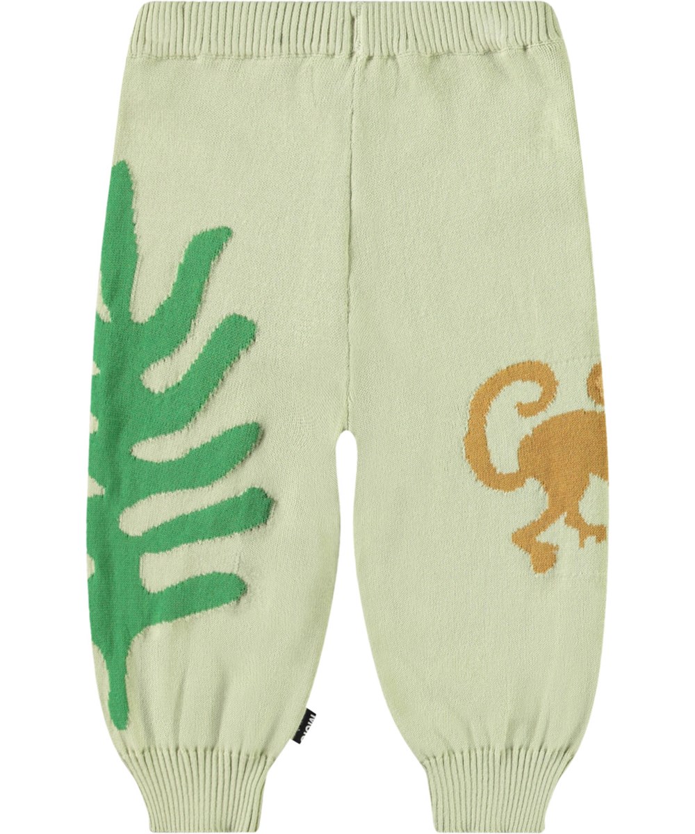 Sol - Jungle Life - Gebreide babybroek van biologisch katoen. Het is lichtgroen met dieren uit de jungle.