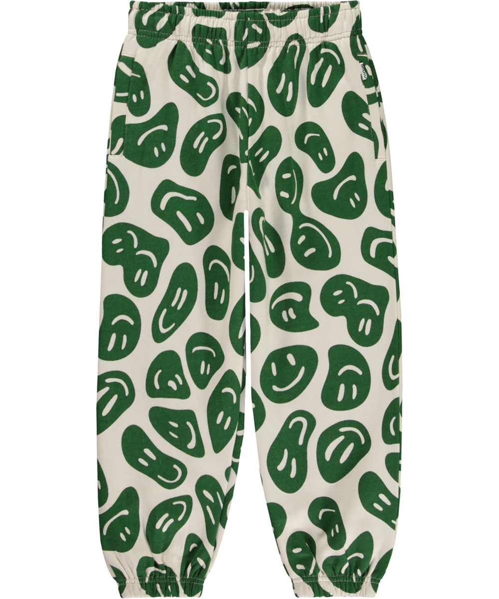 Adan - Smile On Nature - Hvide økologiske joggingbukser med allover grønt smil print