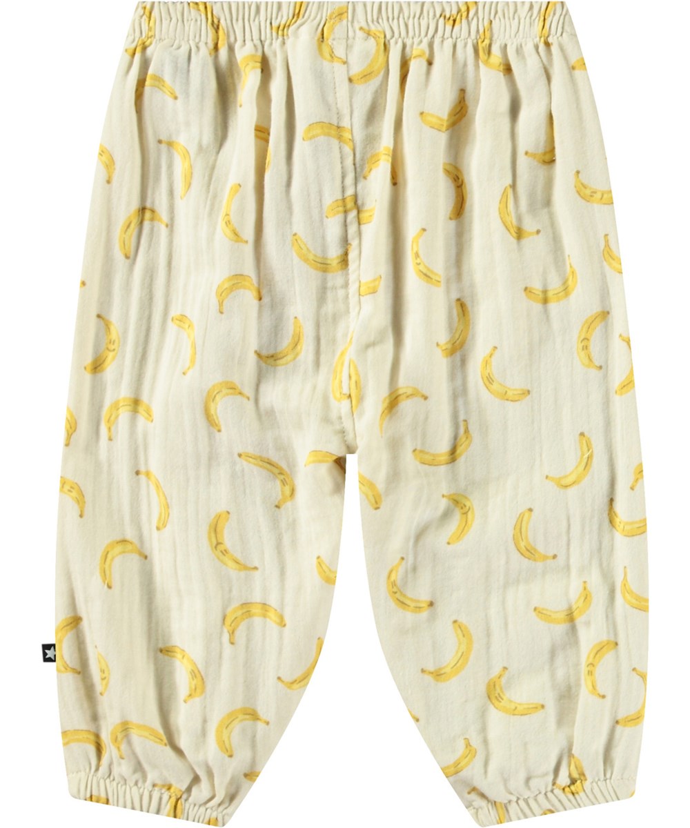 Serene - Cute Bananas - Råhvide bukser til babyer og børn i økologisk bomuld med en løs pasform samt elastik i taljen og benene.