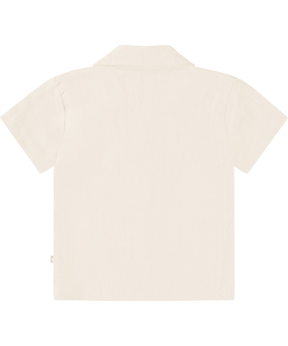 Eyou - Summer Sand - Kurzarmshirt aus Öko-Baumwolle für ein Baby. Das Shirt ist beige mit einem bestickten lächelnden Gesicht.