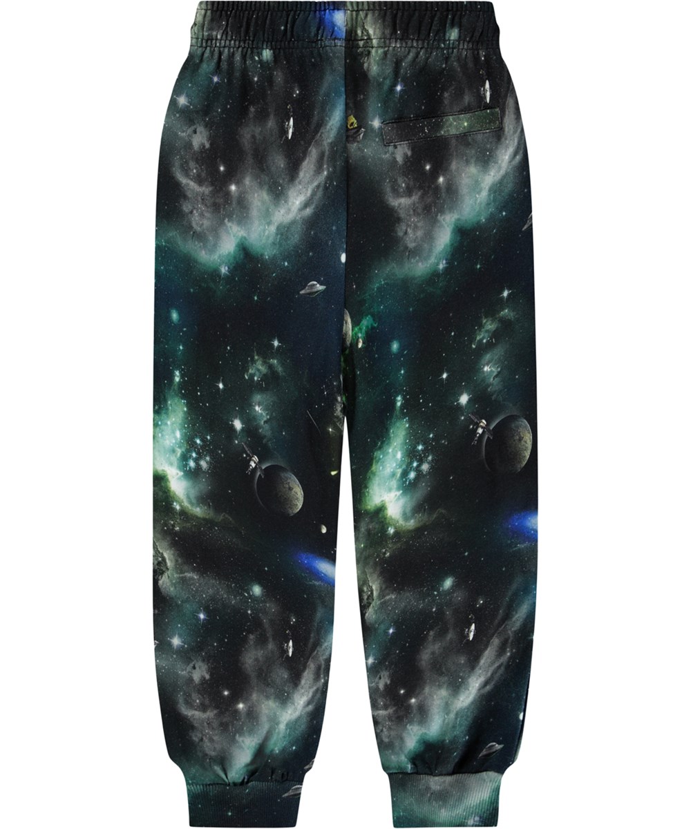 Adani - Deep Space - Bunte Jogginghosen für Kinder aus Öko-Baumwolle mit einem Aufdruck vom Leben im Weltraum.