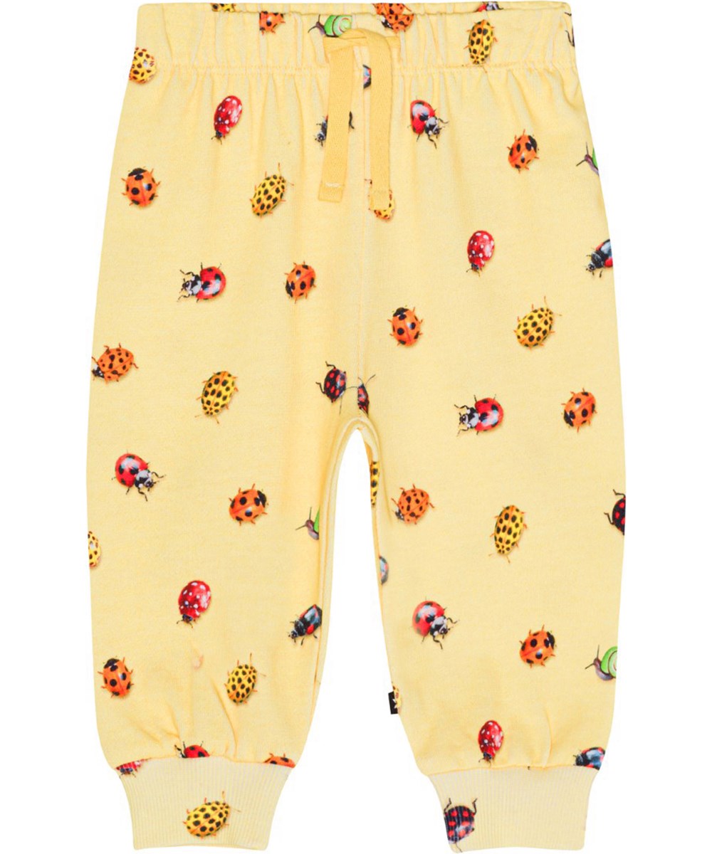 Simeon - Coccinella - Gelbe Jogginghose für die Kleinen aus Öko-Baumwolle mit einem Aufdruck aus bunten Marienkäfern