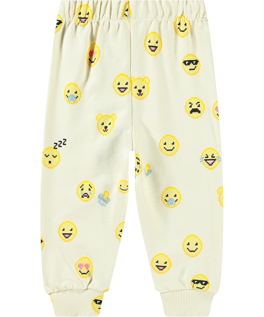 Simeon - Happy Pixels - Blassgelbe Jogginghose aus Öko-Baumwolle mit elastischem Bund und Kordelzug.