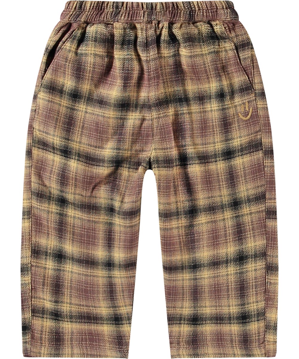 Sois - Bronze Check - Karierte Kinderhose aus Öko-Baumwolle mit elastischem Bund in mehreren Farben.