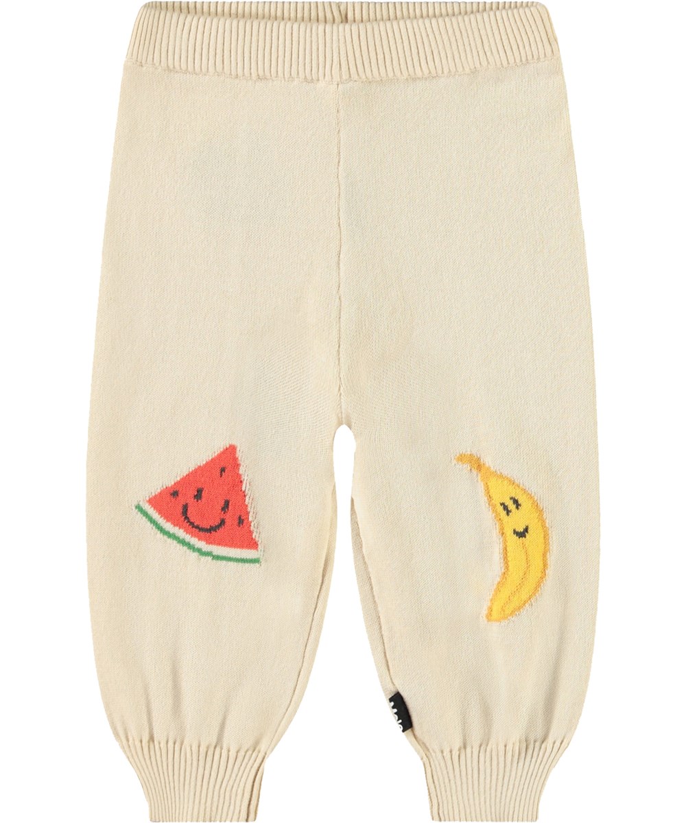 Sol - Cute Fruits - Gestrickte Hose aus Öko-Baumwolle für Babys. Gestrickt in hellem Beige und verziert mit niedlichen Früchten.