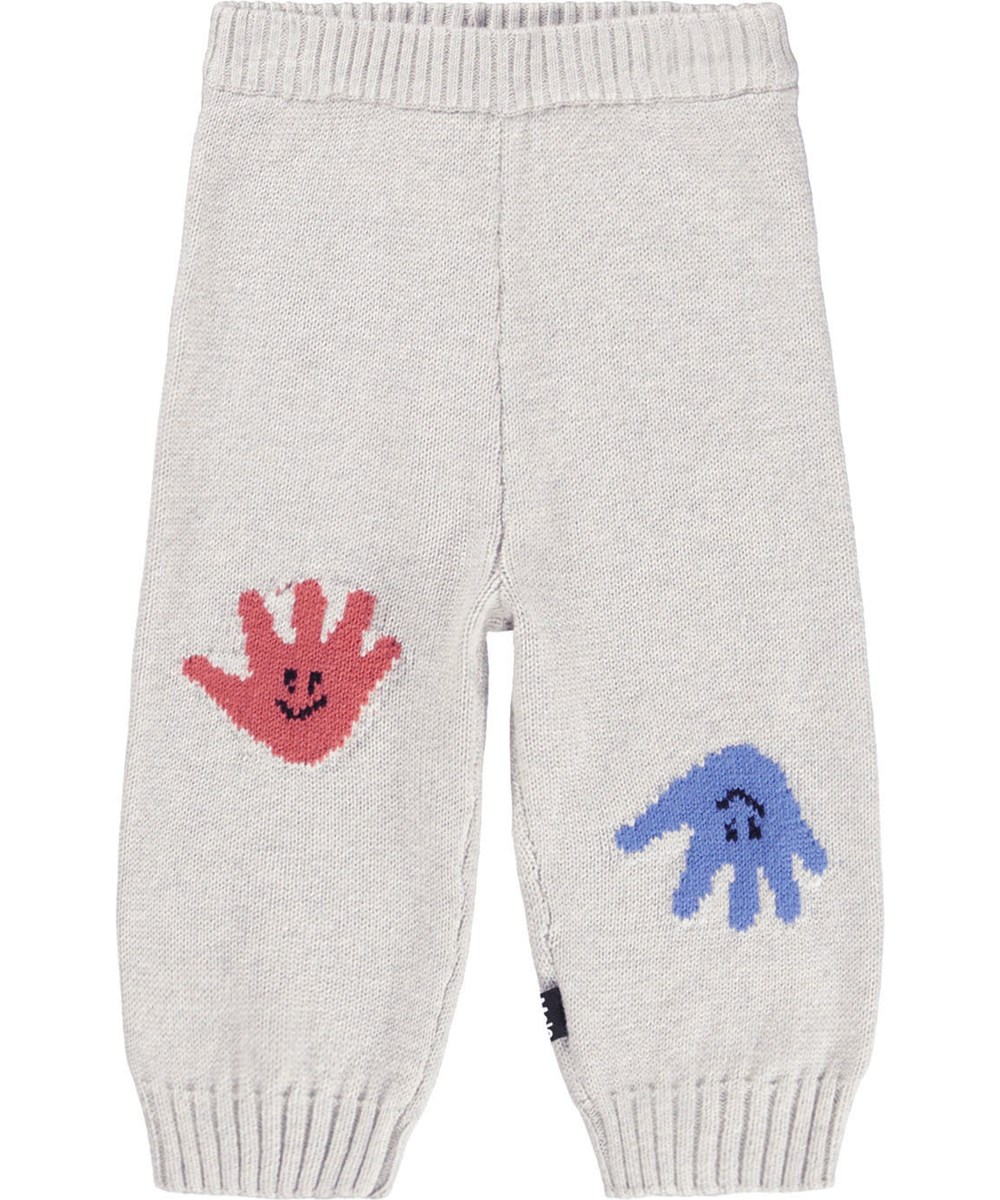 Sol - Happy Hands - Beige Hosen für die Kleinen aus einem weichen Rippenstrick aus Baumwolle und Wolle mit einer lächelnden Hand auf der Vorderseite.
