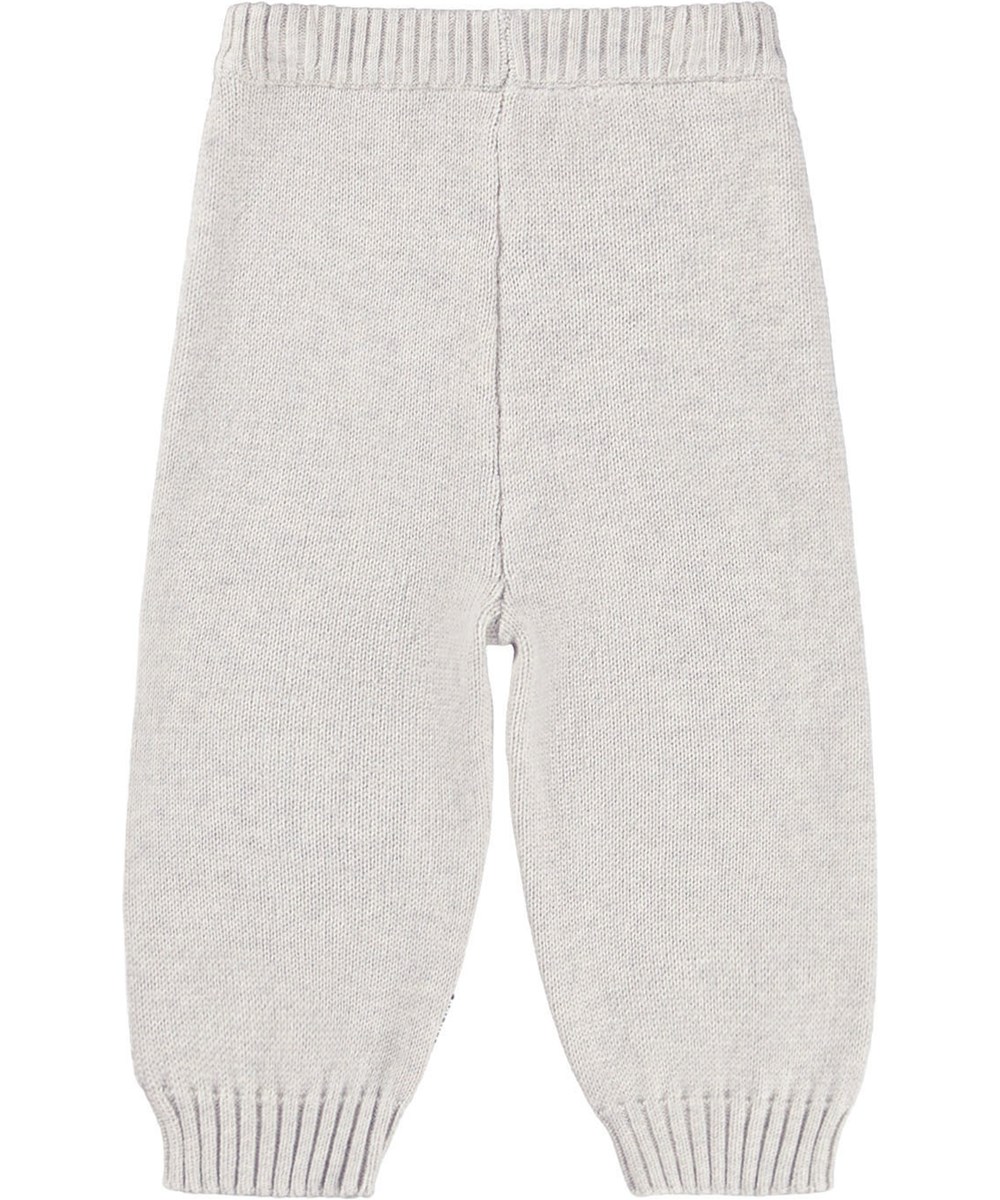 Sol - Happy Hands - Beige Hosen für die Kleinen aus einem weichen Rippenstrick aus Baumwolle und Wolle mit einer lächelnden Hand auf der Vorderseite.