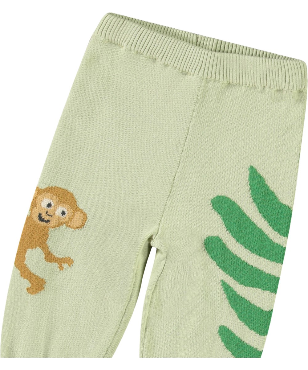 Sol - Jungle Life - Gestrickte Hose aus Öko-Baumwolle für Babys. Gestrickt in Hellgrün und verziert mit Dschungeltieren.