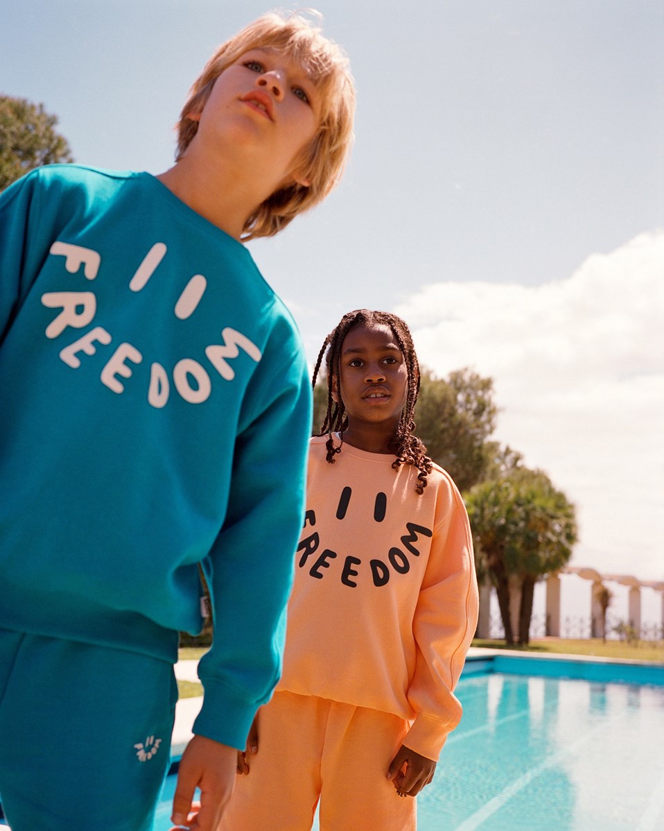 Adian - Cantaloupe - Oranje biologisch katoenen joggingshort voor kinderen.