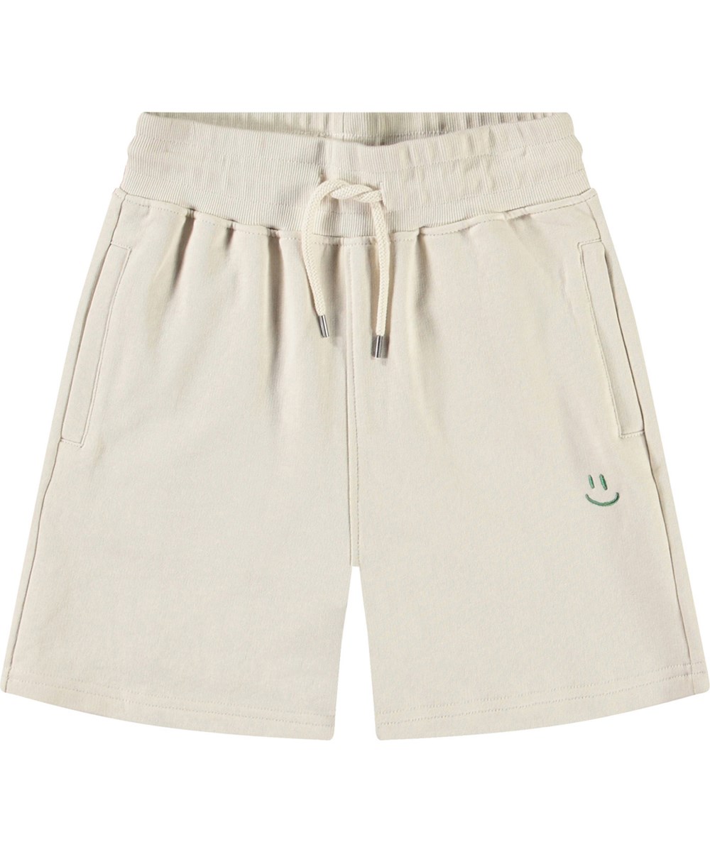 Alw - White Noise - Beige kindershort van biologisch katoen met een groene smiley.