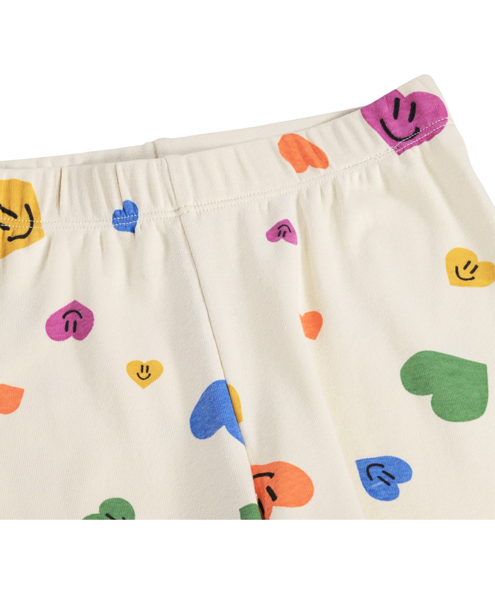 Lou US - Confetti Smiles - Beige todelt nattøj med hjerteprint i økologisk bomuld til børn