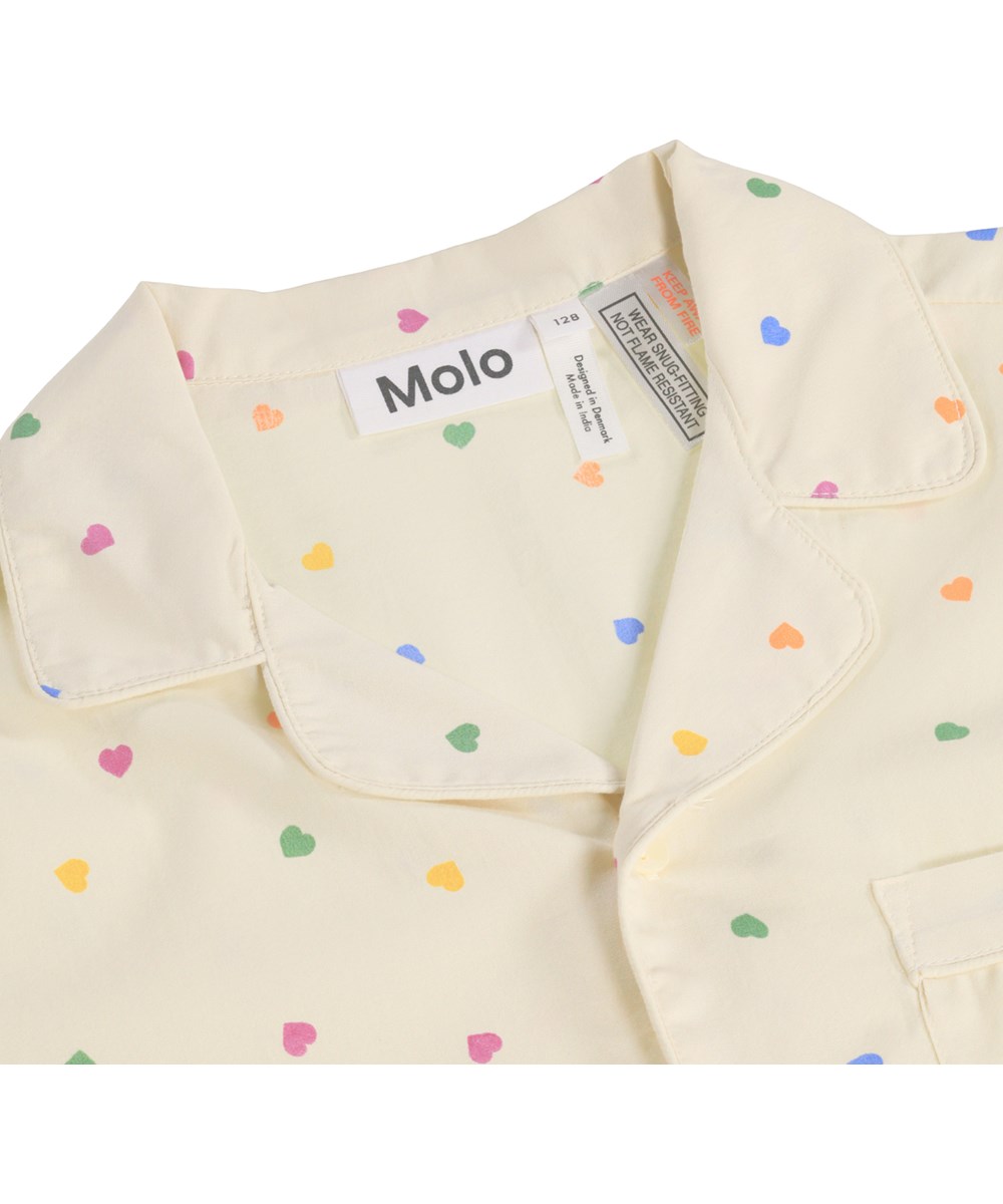 Lex - Confetti_Rainbow - Beige pyjama set for children made of organic cotton with a print 