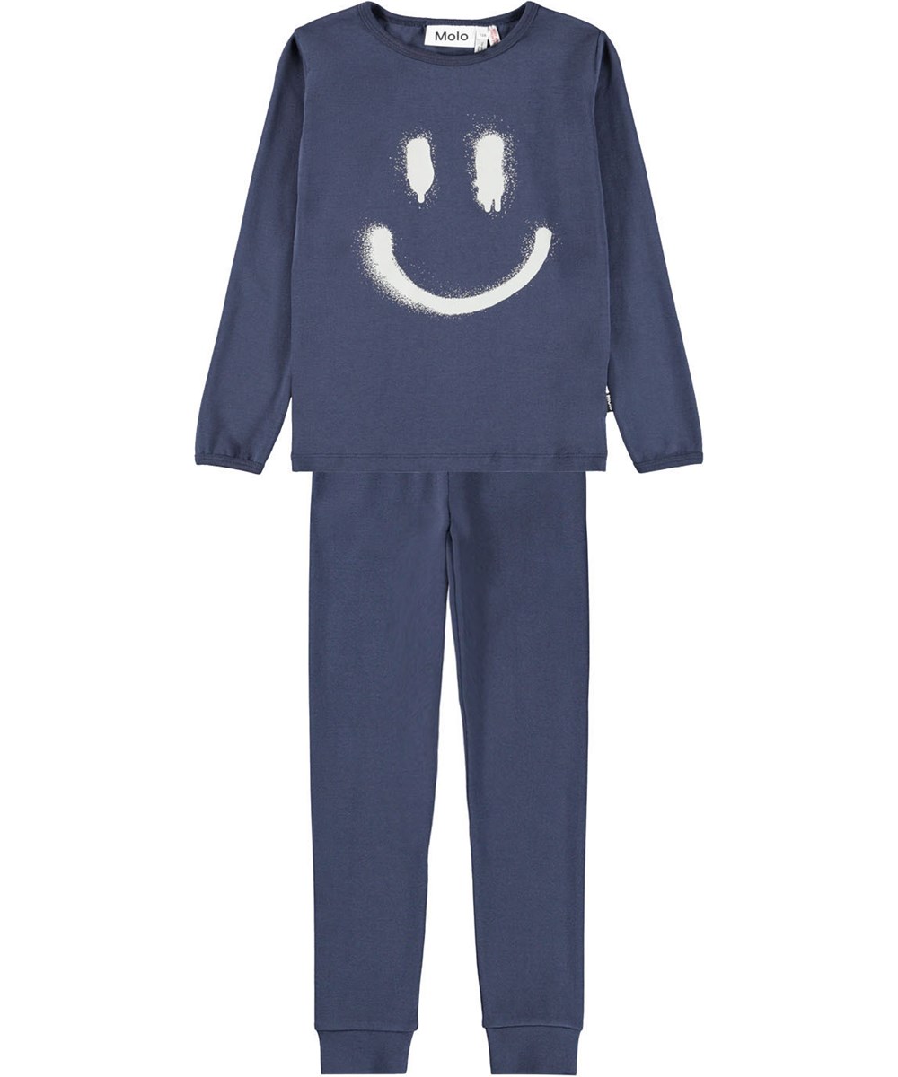 Lue - Galaxy Blue - Dark blue pyjama set for children made of organic cotton with a spray-painted smile in white.