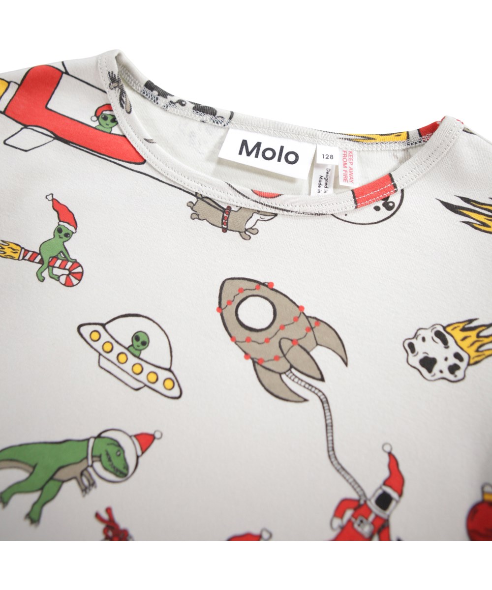 Lue - Spacy Nights - Beige pyjama set for children made of organic cotton with a print of a colourful Christmas in space.