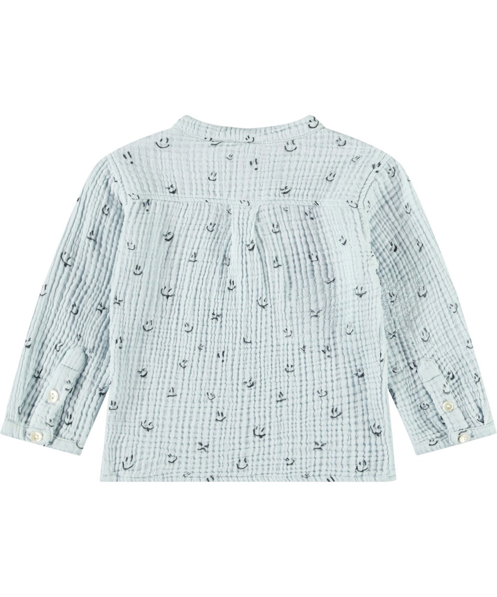 Enoz - Moods - Babyblouse van biologische gekreukte katoen. De blouse heeft een print van smiley's.
