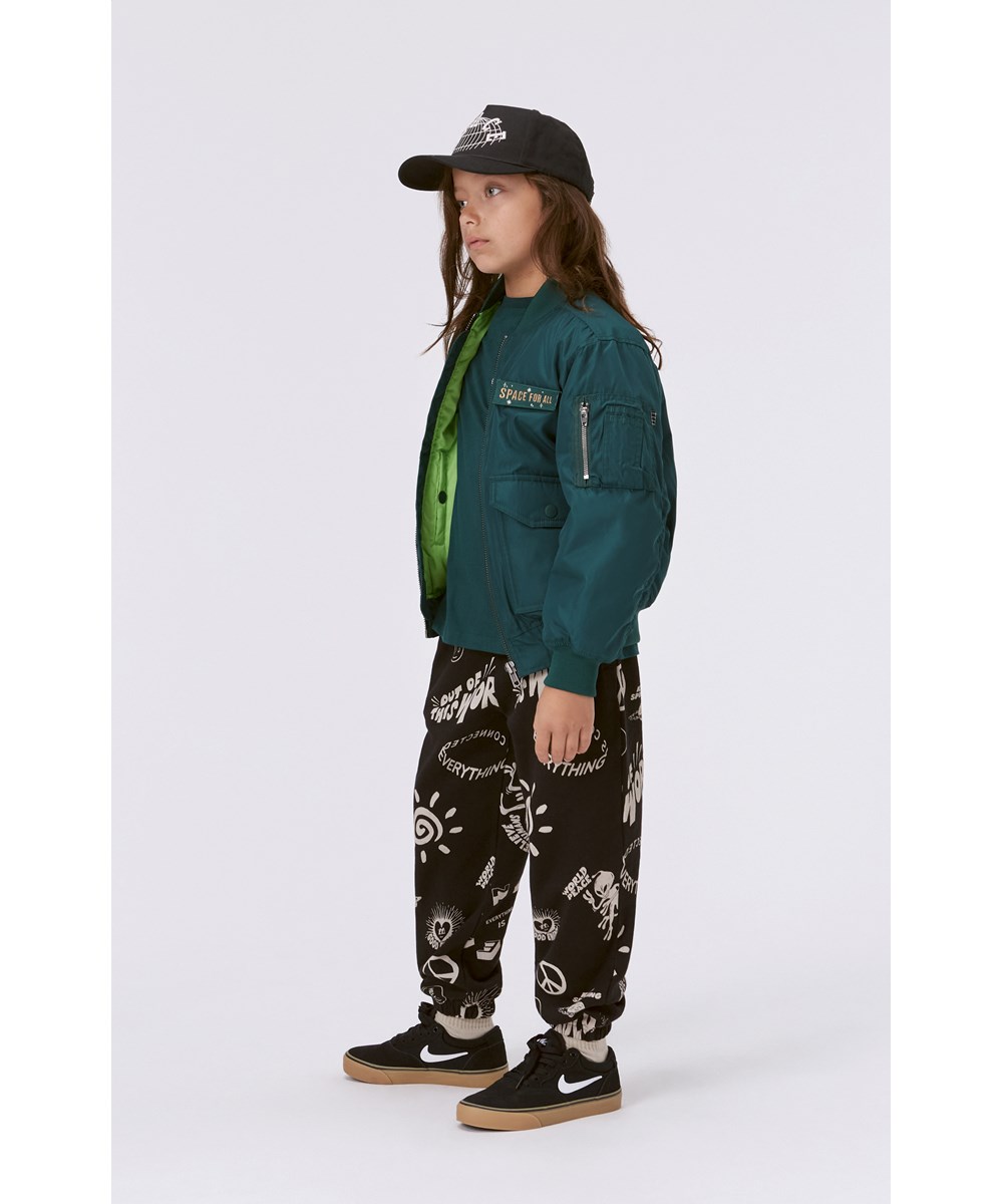Adan - Live It Up - Black organic joggers with all over print mix