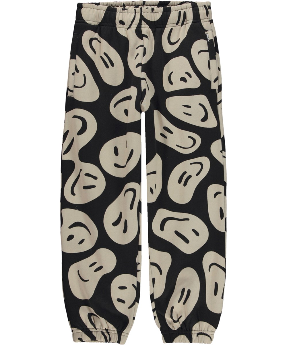 Adan - Smile On Black - Black and beige organic joggers in all over print 