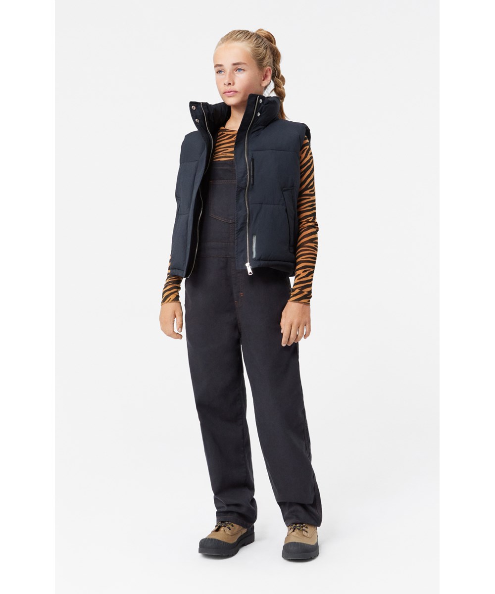 Aer - Black - Black dungarees with copper-coloured stitching and adjustable braces.