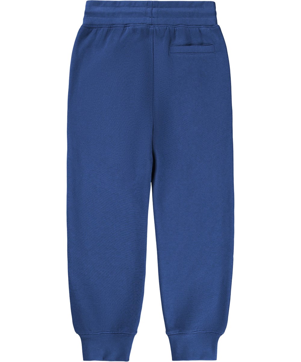 Alvar - Blue Depths - Blue sweatpants made of organic cotton with embroidered white smiling face.