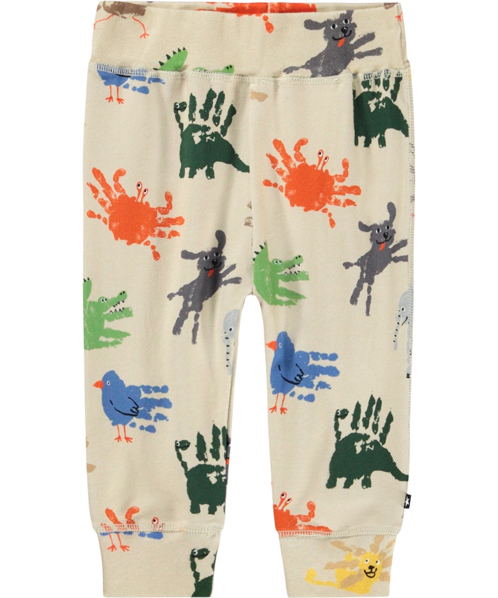 Sammy - Hand Animals - Beige pants for the little ones made of soft organic cotton jersey with a print of colorful handprints that looks like animals.