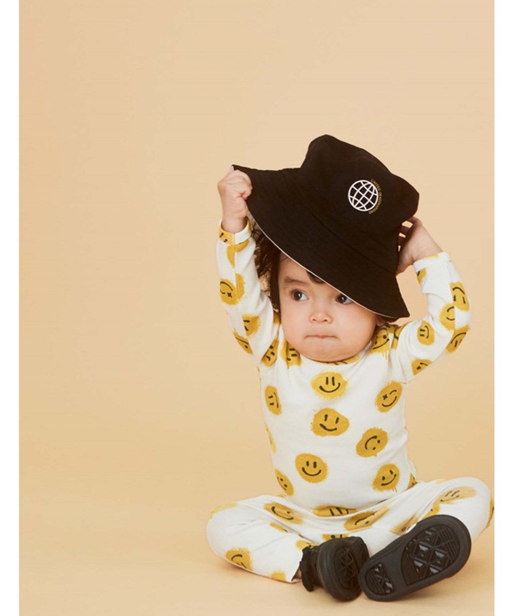 Seb - All Smiles - Organic baby trousers with smiley faces
