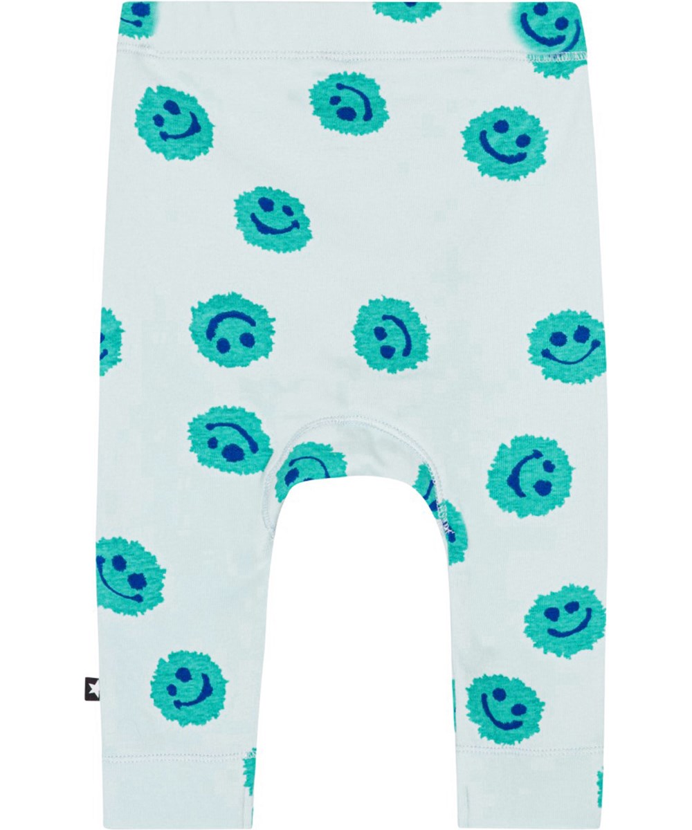 Seb - Aquarelle Blobs - Light blue leggings for small children in organic cotton with a print of smiling faces 