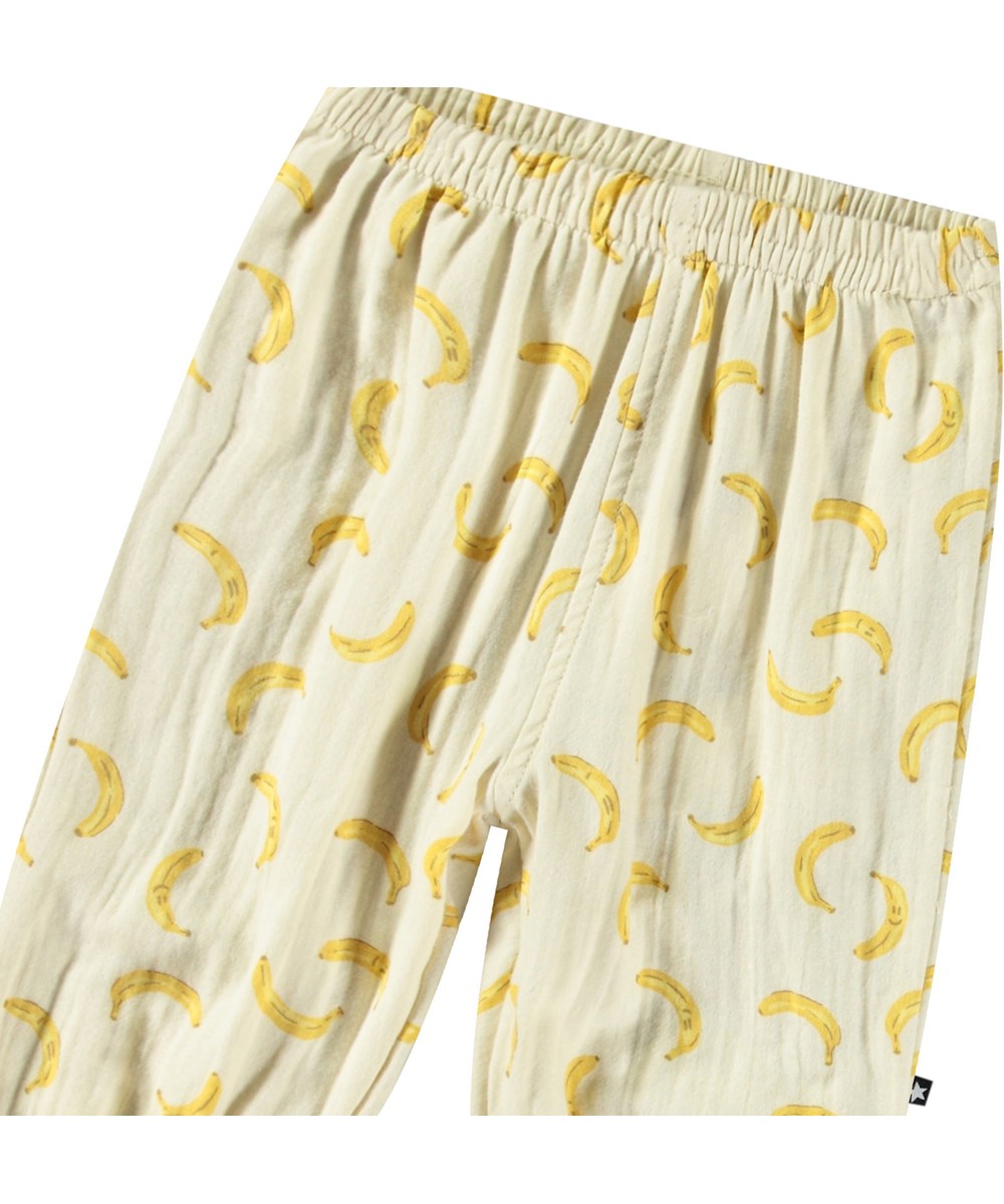 Serene - Cute Bananas - Off-white pants for babies and children in organic cotton with a loose fit, elastic waist, and legs.